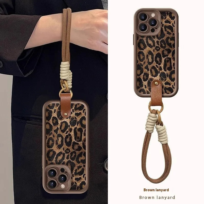 Brown leopard print silicone phone case for iPhone with an attached white lanyard strap.