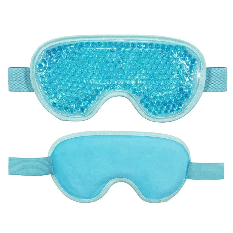 White portable rechargeable eye mask device for hot compress and atomisation, shown with USB cable.