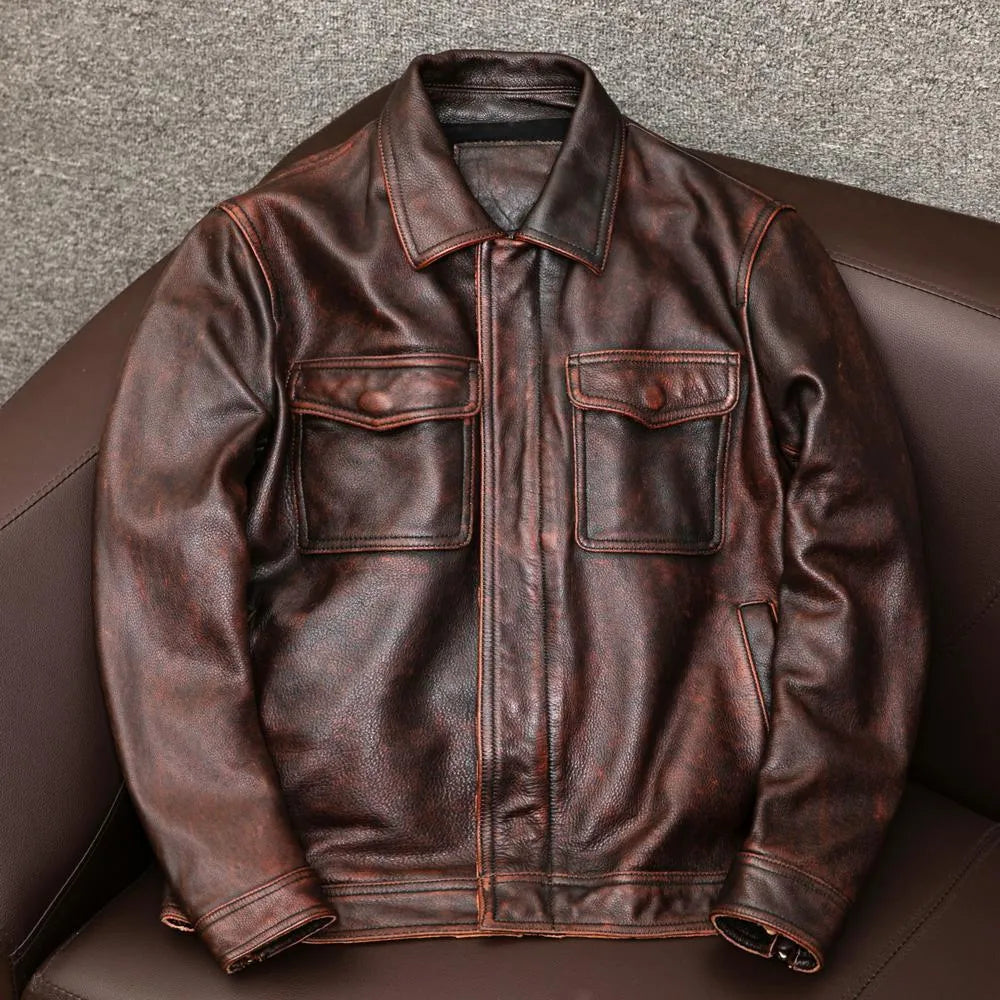 Men's plus size black retro lapel leather jacket with loose fit on hanger.