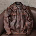 Men's plus size black retro lapel leather jacket with loose fit on hanger.