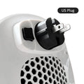 White plastic ceramic heating electric heater with remote control on a table