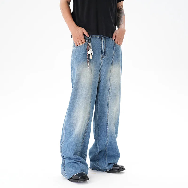 Cut washed vintage washed wide leg machete jeans in light blue denim fabric with zip fly
