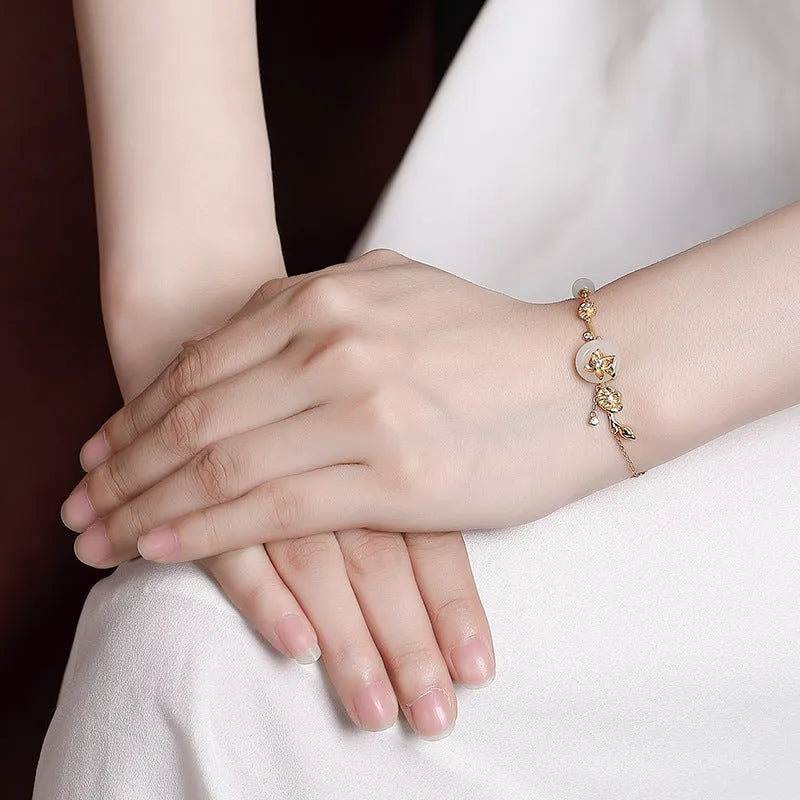 Women's silver bracelet with Hetian jade peace buckle design in gold or silver plating