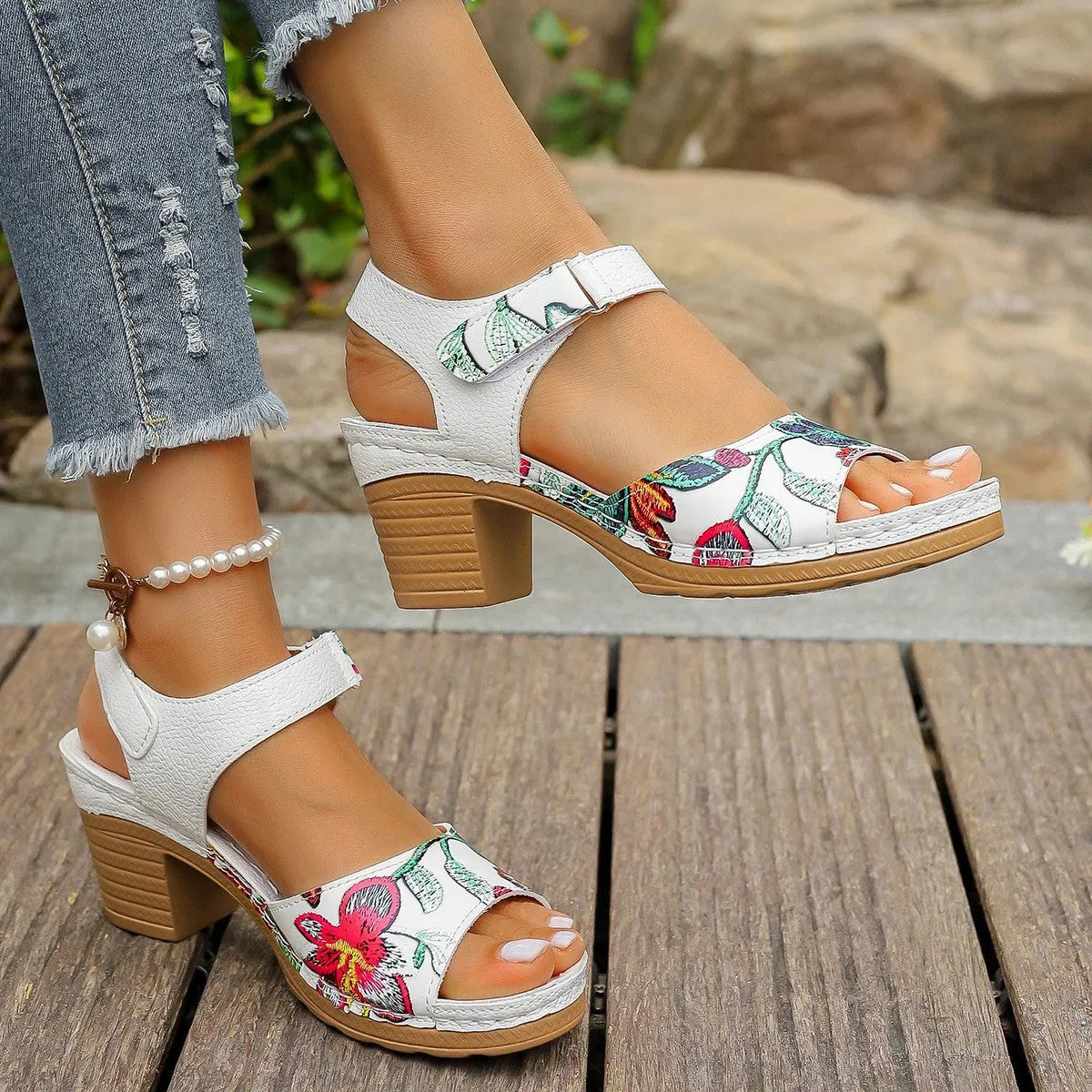 White women's high heel sandals with an adjustable Velcro strap buckle.