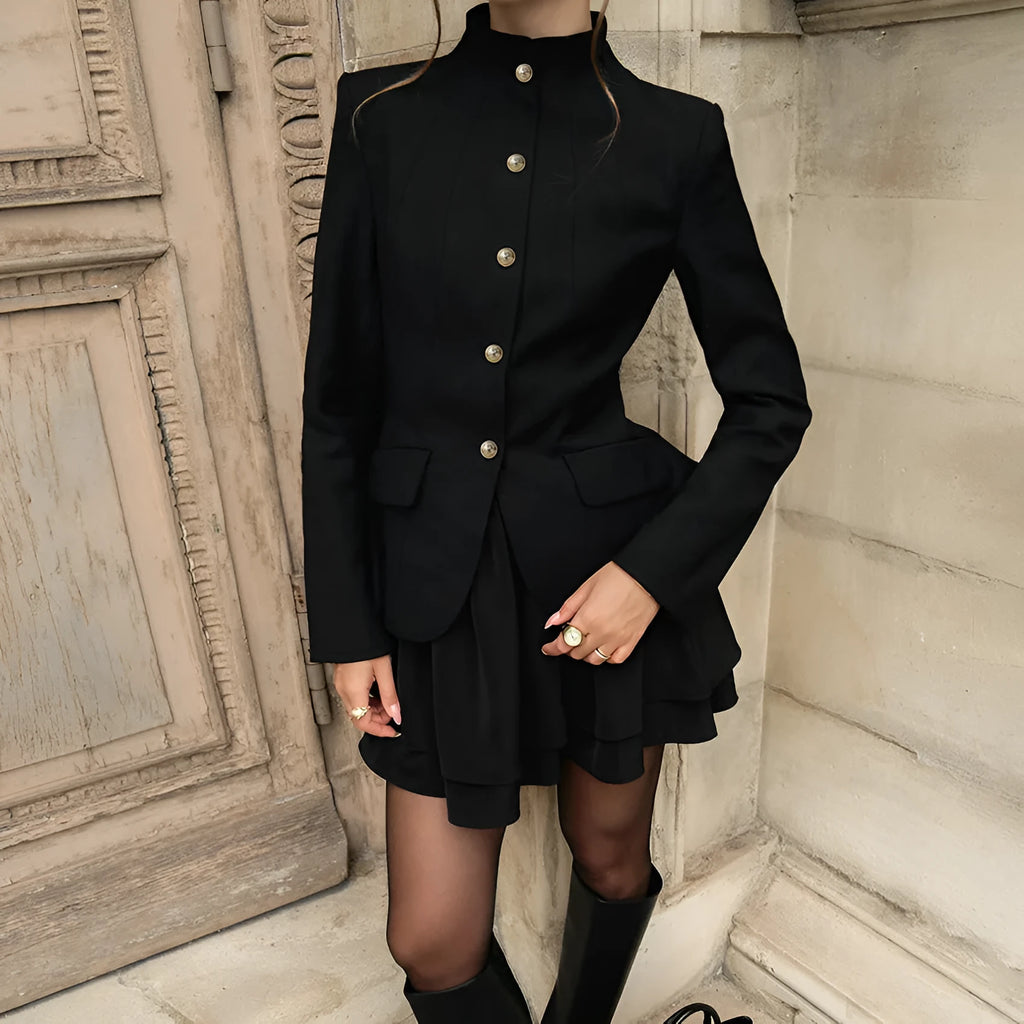 Women's black solid colour stand collar suit set with blazer and short dress on display