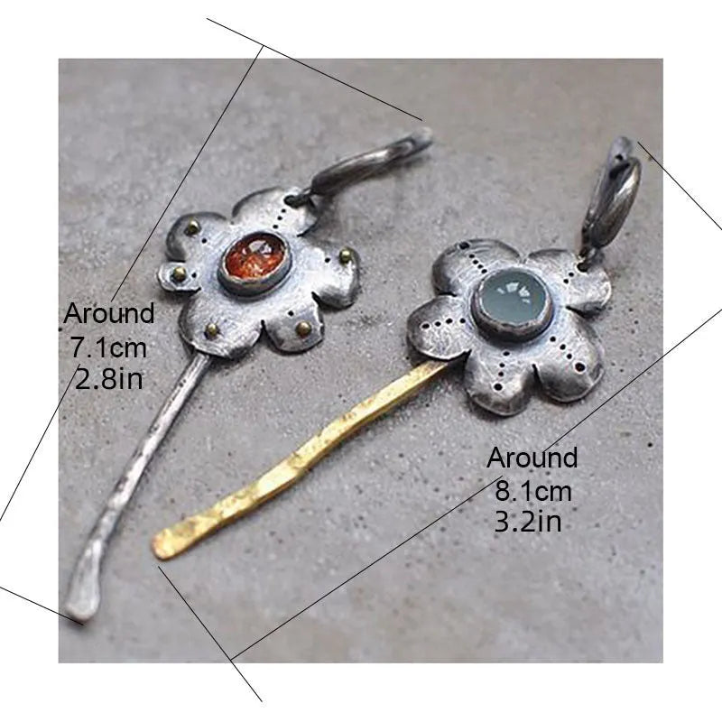 Long geometric flower earrings with two-tone asymmetrical colour on alloy metal.