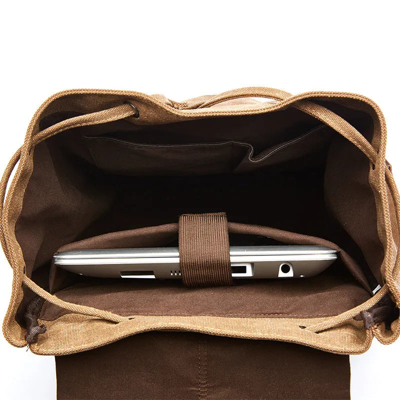 Canvas travel backpack in solid colour with sewing line details, capacity below 20L
