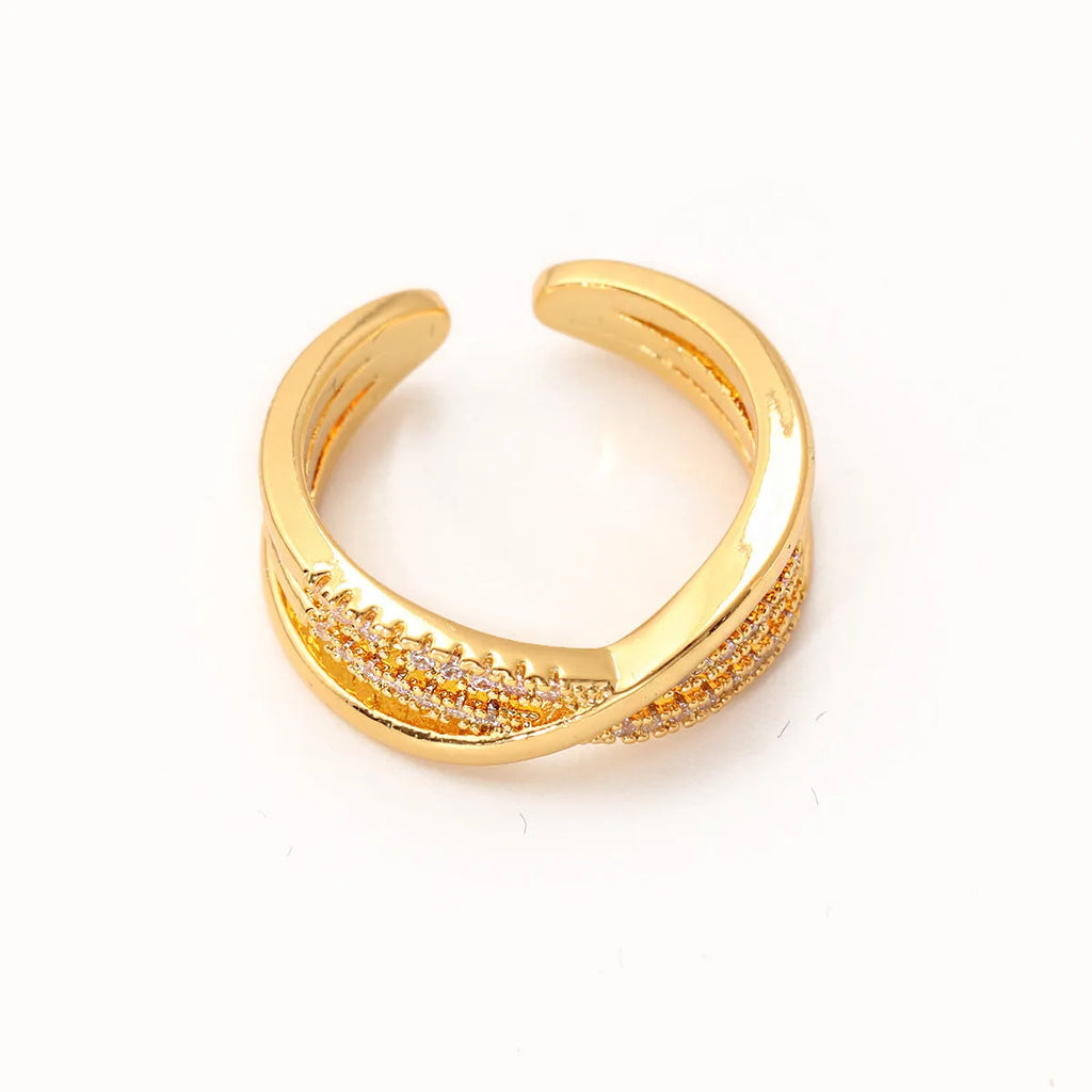 Women's gold open ring with geometric line pattern on copper base