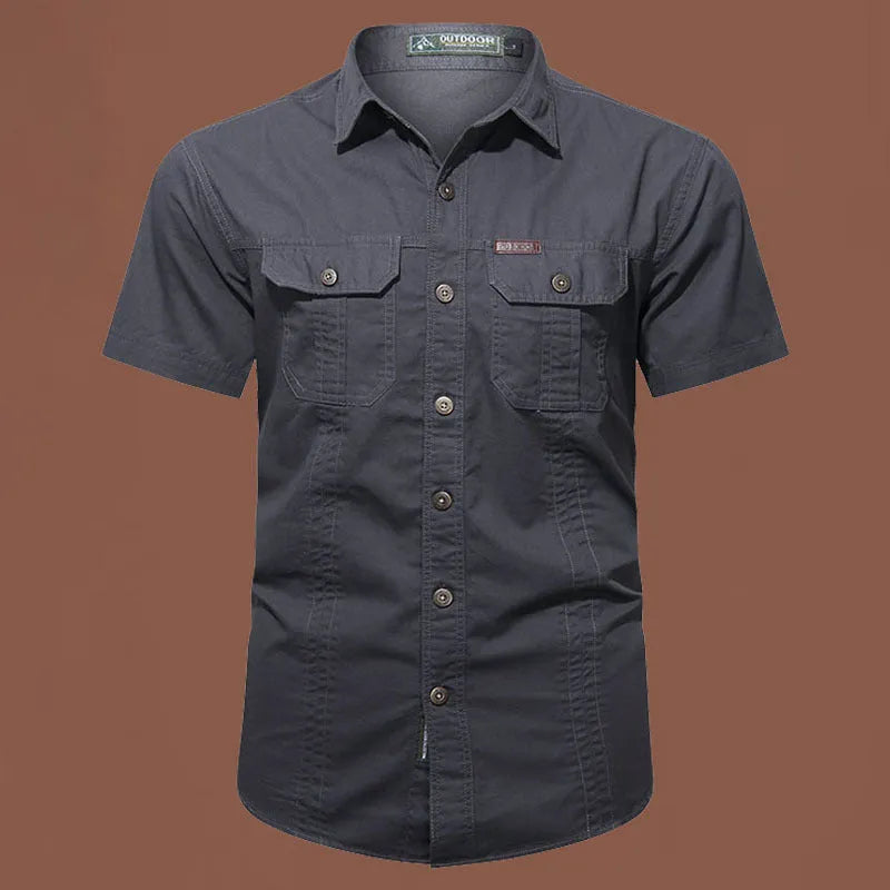Men's army green short sleeve cotton work shirt with a loose cardigan fit on a hanger.