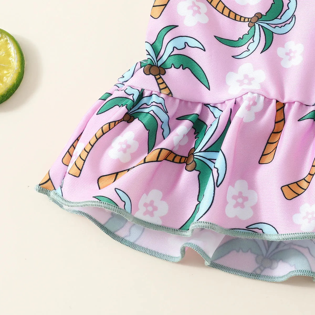 White children's two-piece swimsuit set with shirt and shorts, suitable for ages 6 months to 3 years.