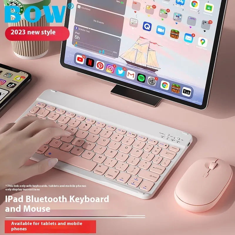 Bluetooth keyboard and matching rechargeable mouse set in elegant pink colour on a desk next to a tablet.