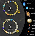 Pair of natural stone beaded bracelets showing different zodiac sign designs on a table.