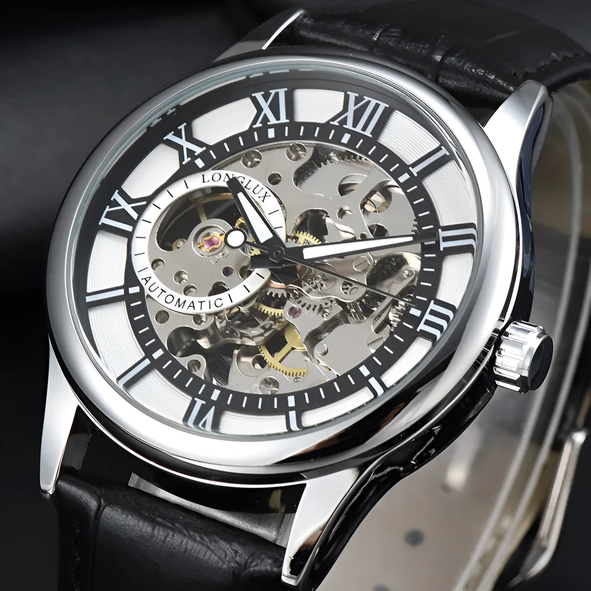 Men's mechanical watch with Roman scale dial, metal case, and faux leather strap on wrist