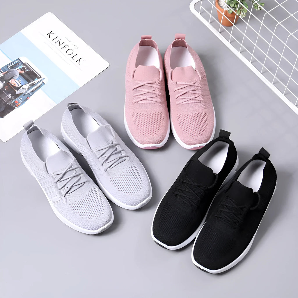 Women's black mesh lace-up casual sneakers with a round toe and non-slip sole on a white background.