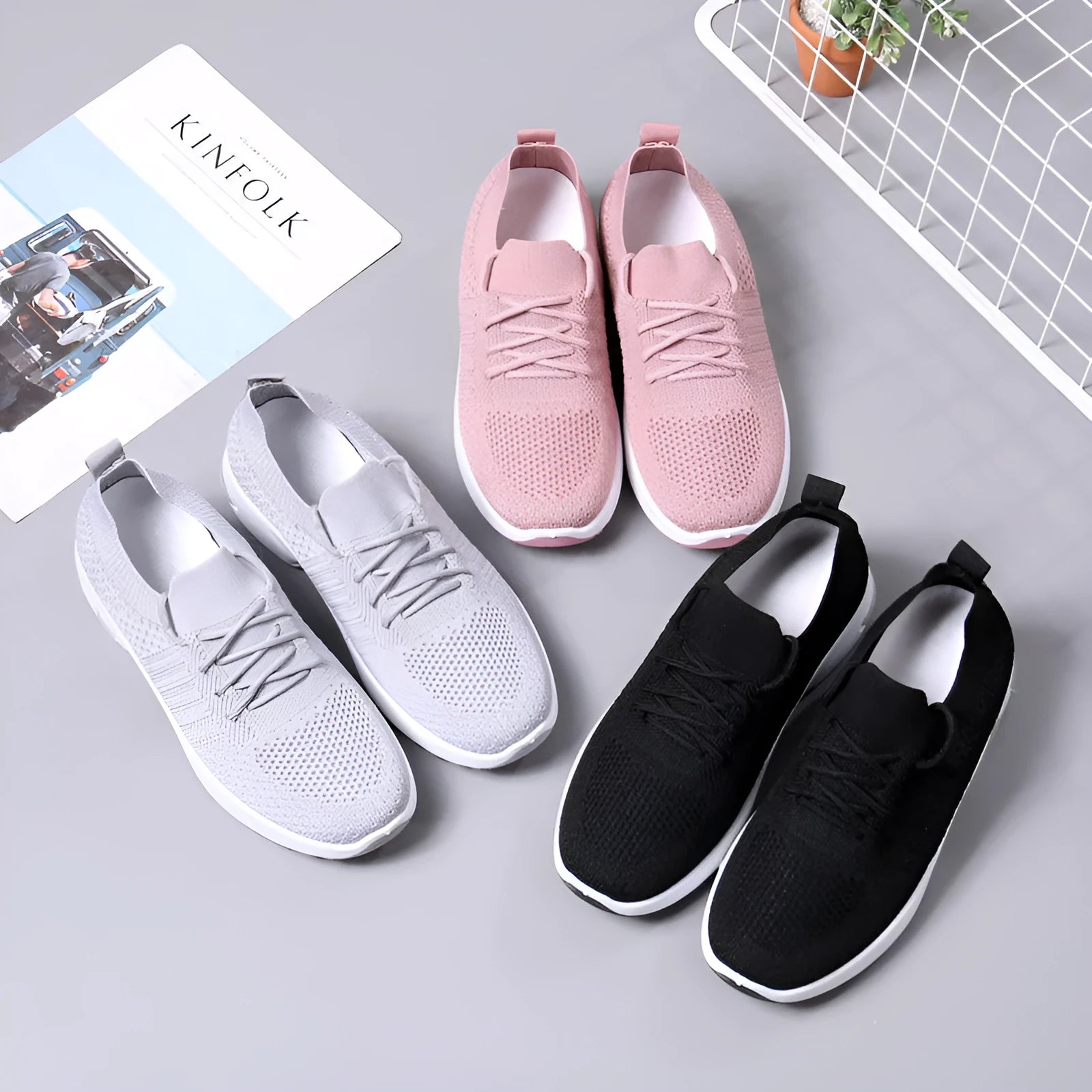 Women's black mesh lace-up casual sneakers with a round toe and non-slip sole on a white background.