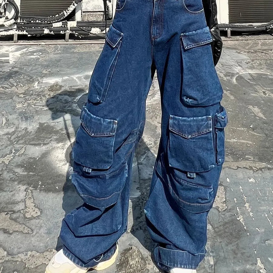 Dark blue distressed wide-leg jeans with a high waist and multiple pockets laid flat