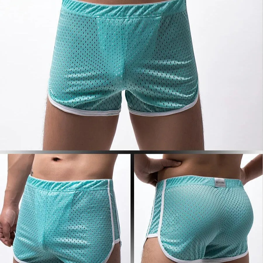 Men's black cotton blend boxer shorts with a mid-waist waistband laid flat.