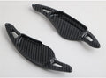 Steering wheel paddle shifters in carbon fibre black finish for manual gear control enhancement
