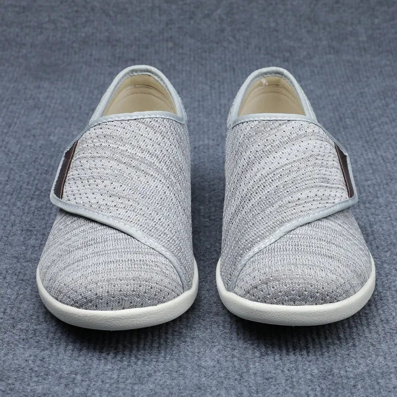 Beige leisure shoes with a velcro strap, textile and synthetic leather upper, and a rubber sole.