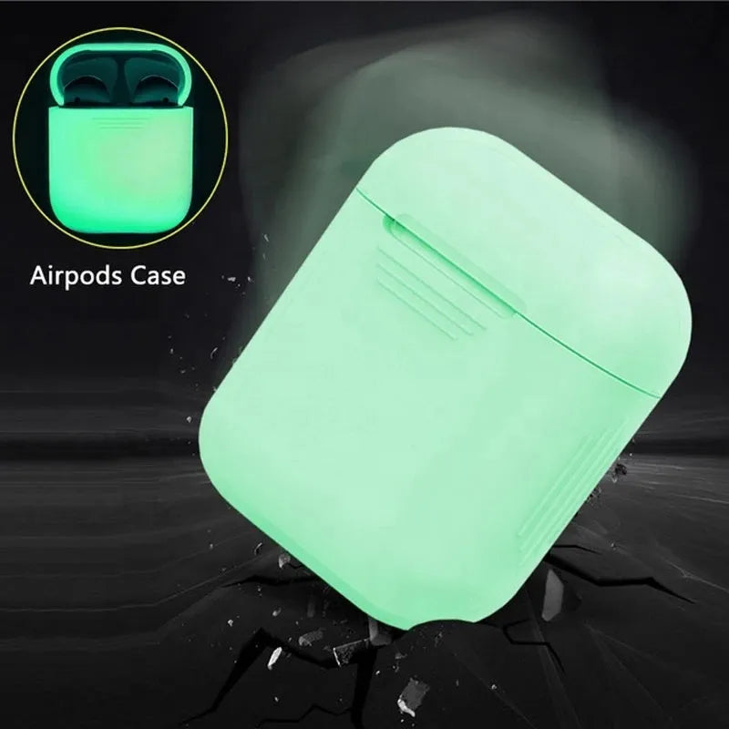Glow-in-the-dark silicone flip cover case for Apple AirPods charging case on a dark background