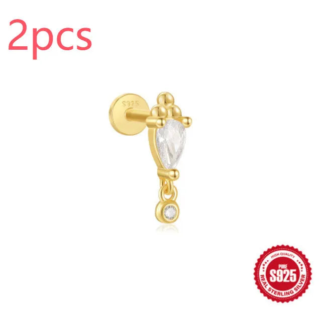 Sterling silver ear stud with a hanging gold-tone tassel charm on a white background.