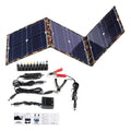 Black foldable portable solar panel unfolded showing three solar cells, with car charger and cables.
