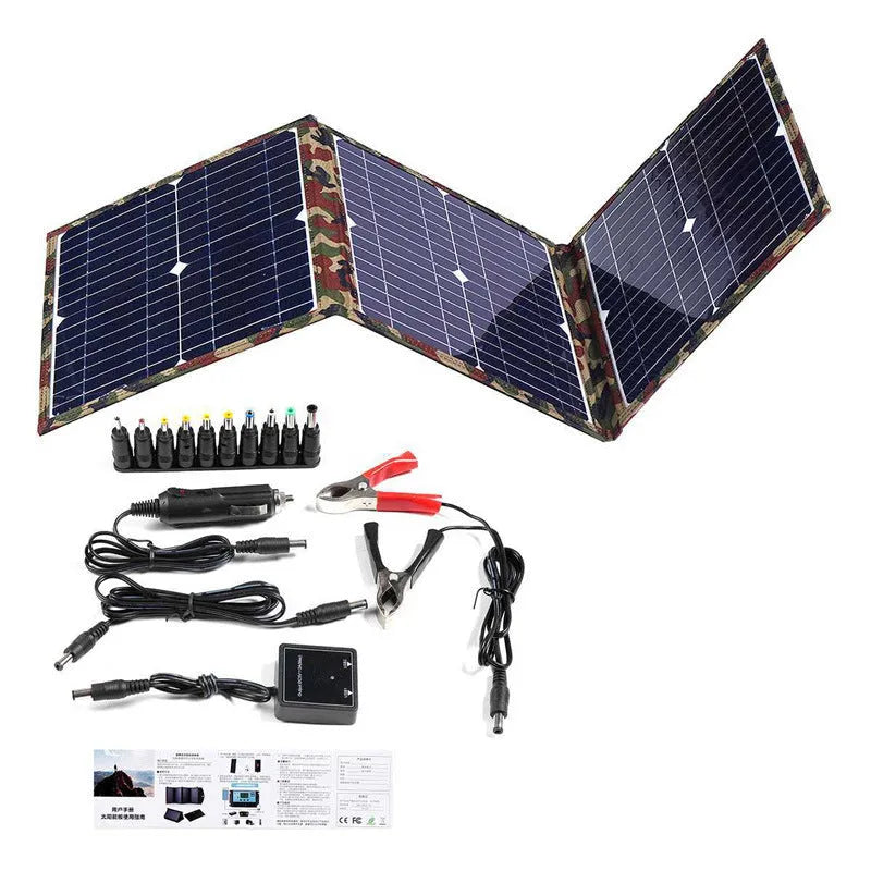 Black foldable portable solar panel unfolded showing three solar cells, with car charger and cables.