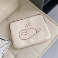 Embroidered fat cat design on a navy blue nylon tablet protective sleeve with a black zipper.