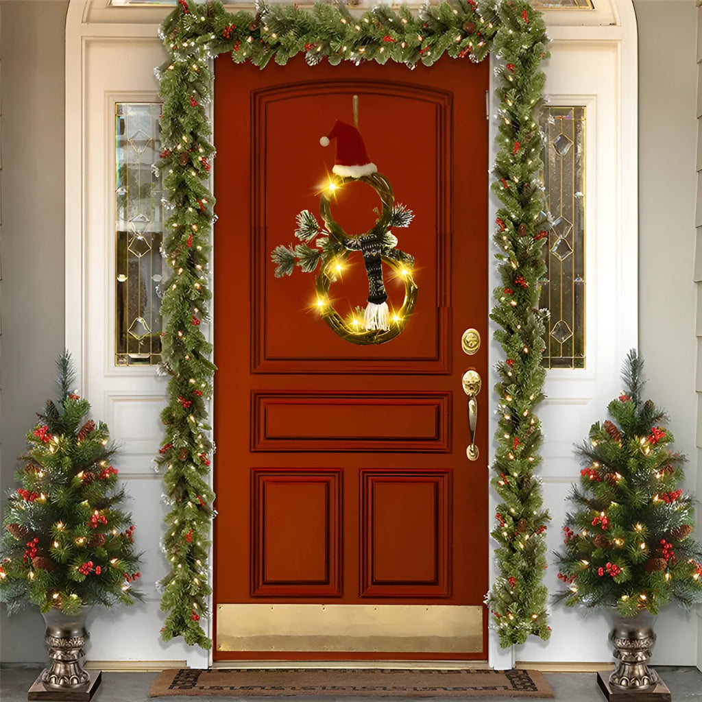 Christmas wreath made of pine needles on a vine circle base in red and grey colours for door decoration