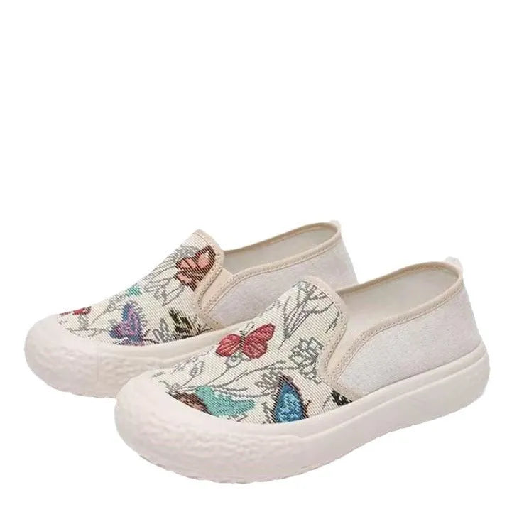 Women's canvas slip-on shoes with plastic injection-moulded sole and decorative sewing thread details