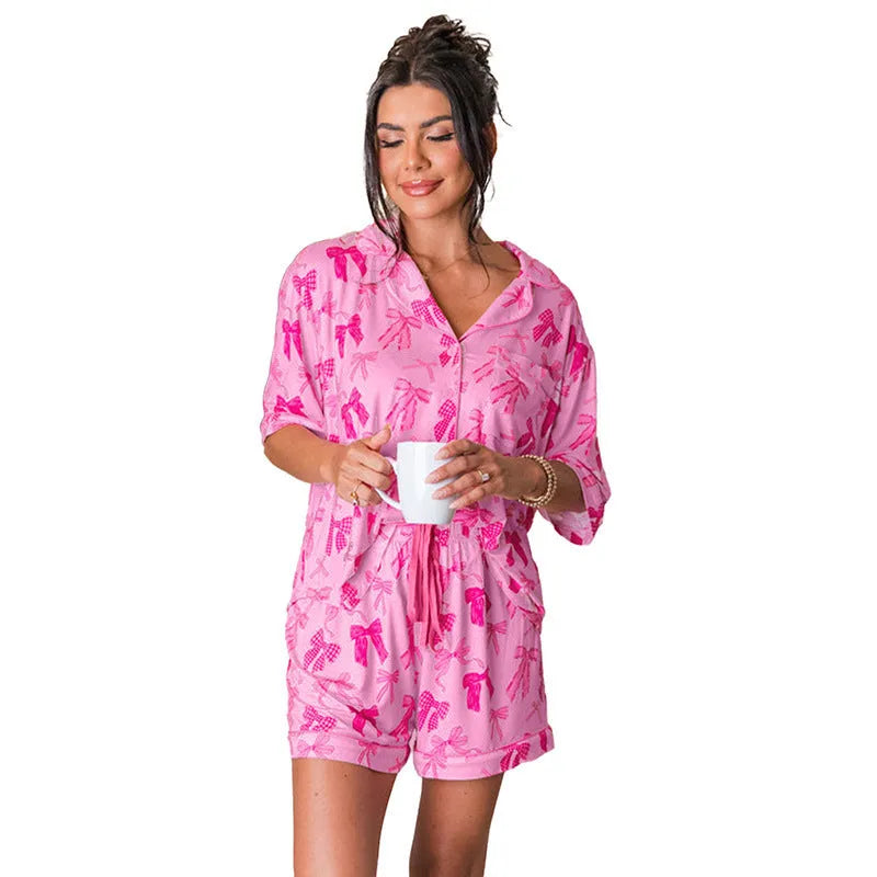 Pink bow print two-piece polyester pajama set with matching top and pants