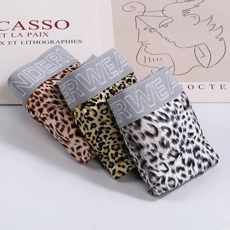 Men's loose fit leopard print boxer shorts in polyester milk silk fabric showing mid-waist design