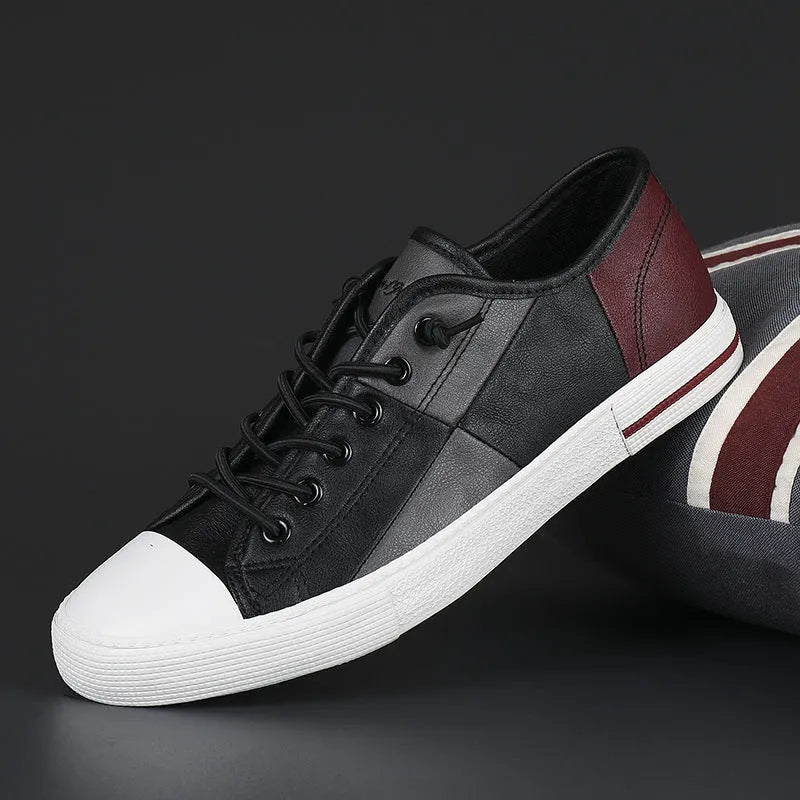 Men's flat leather shoes in a colour matching design with an elastic band closure and round toe