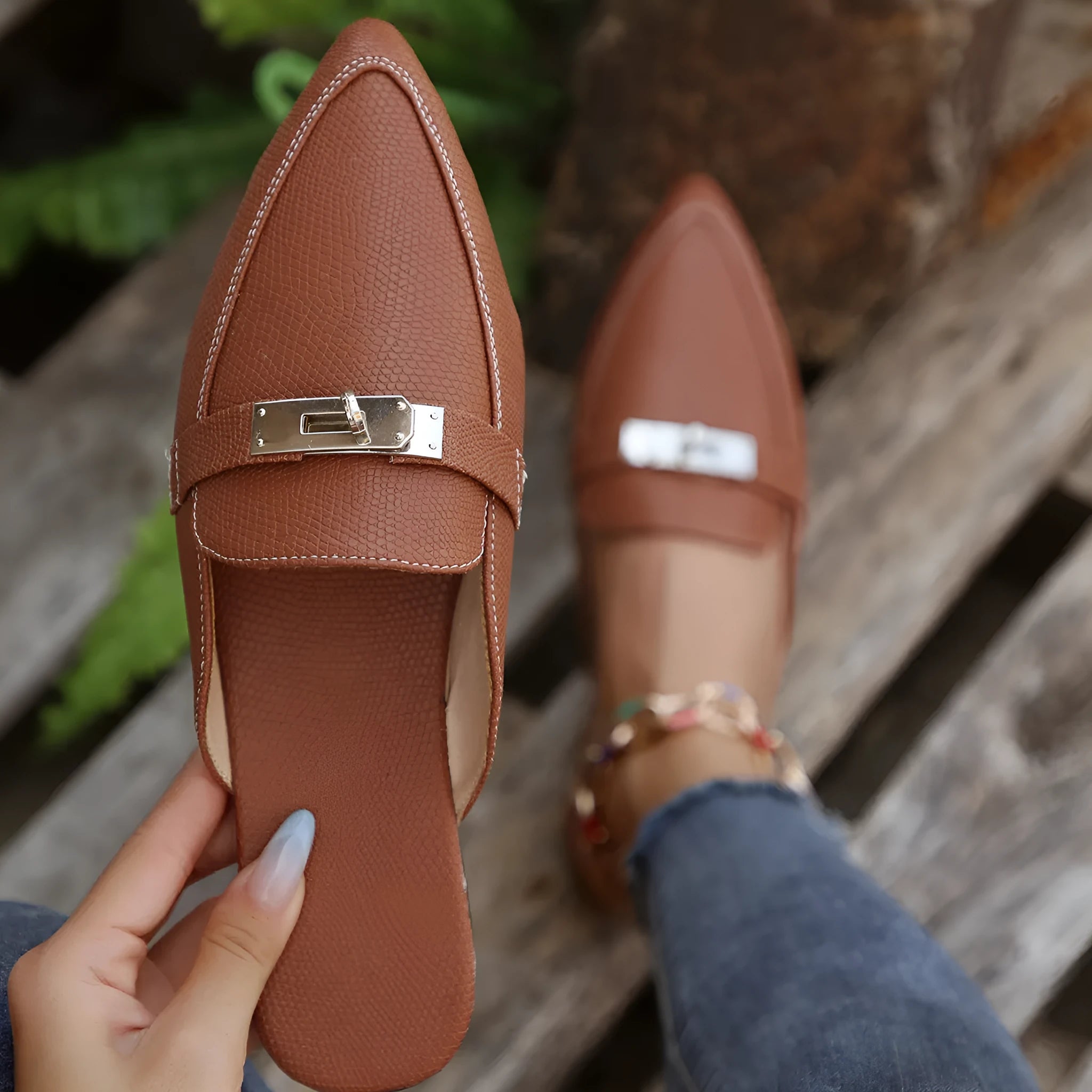 Light brown women's pointed-toe semi-slippers with a low heel and rubber sole on a white background.