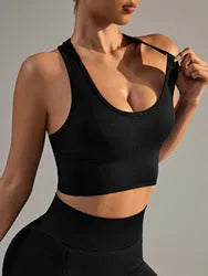 Black women's cross-back sports bra with fixed double straps and moulded cups.