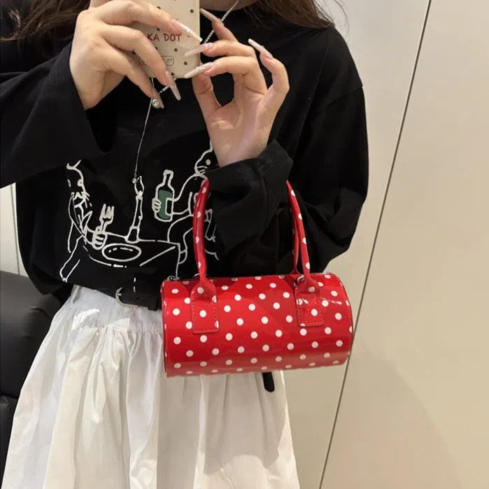 Korean-style PU leather tote pillow bag in black, white, and red colours, cylindrical shape with stitched seams and single shoulder strap, 20x10x10cm