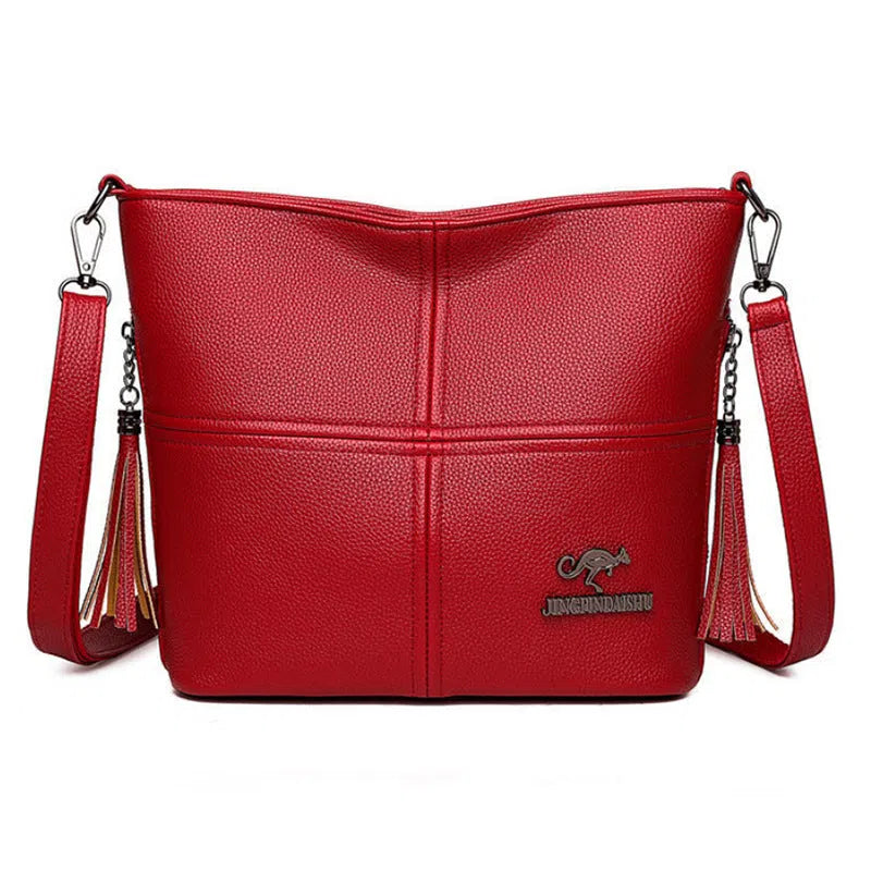 PU crossbody bag in red with stitching and tassels, horizontal shape, large capacity