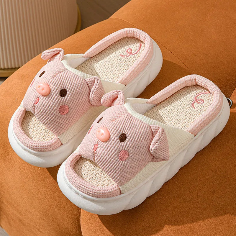 A pair of open-toe linen flip flop slippers for couples, shown in a choice of colours with a cushioned footbed.