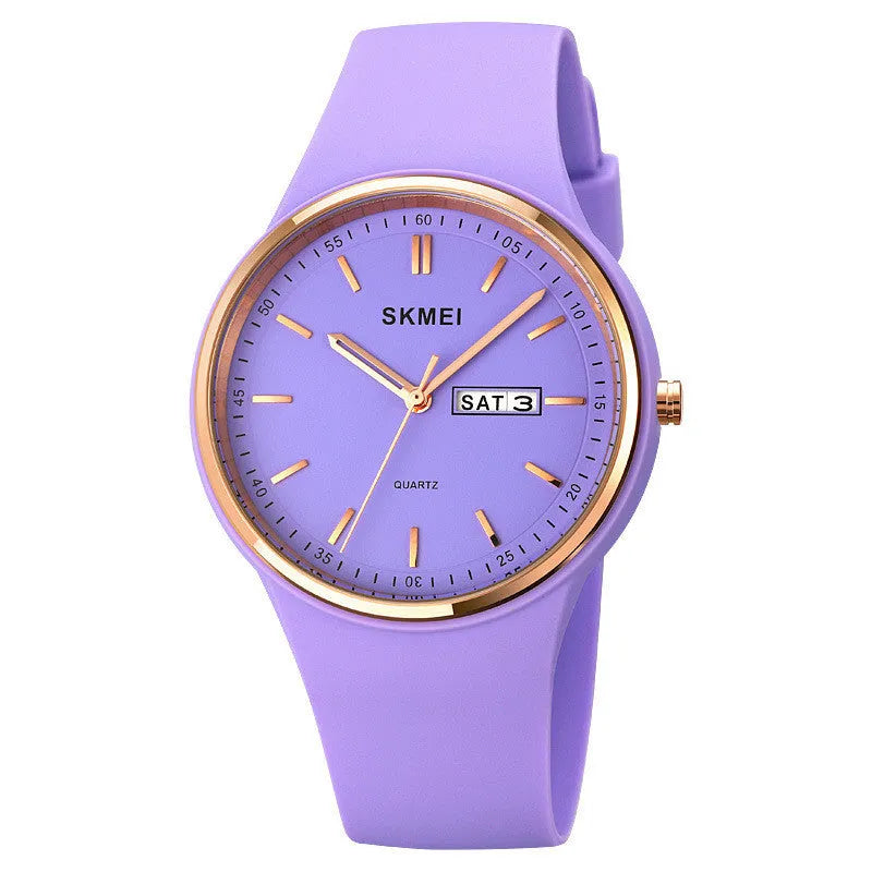 Women's silicone strap quartz watch with 42mm dial and calendar on a wrist, showing light blue colour option.