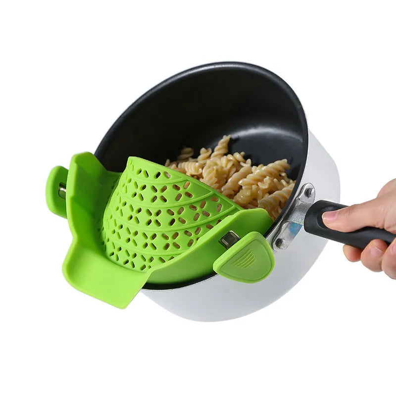 Silicone and stainless steel pot drain stopper kitchen gadget in assorted colours.