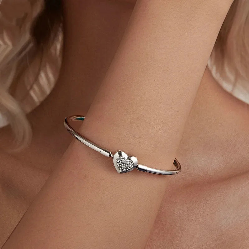 S925 sterling silver heart-shaped cubic zirconia bracelet with buckle clasp on white background