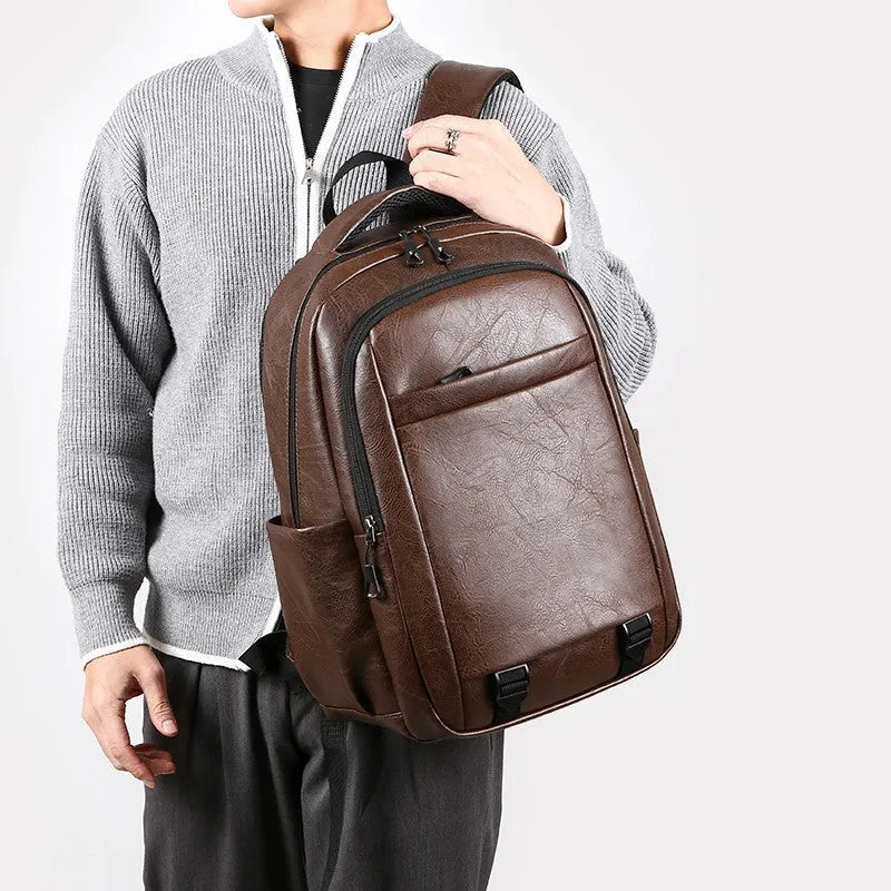 Men's large capacity PU backpack in khaki, 47x33x18cm, with curved shoulder straps and main compartment opening