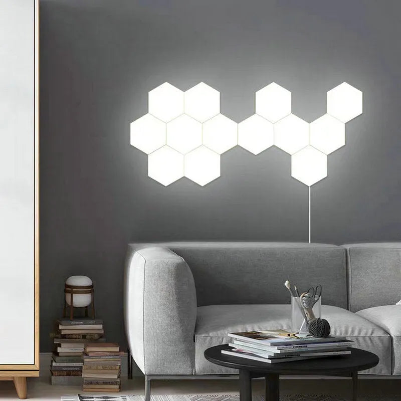 Close up of a modular hexagon LED wall light in a honeycomb pattern with multiple colour panels