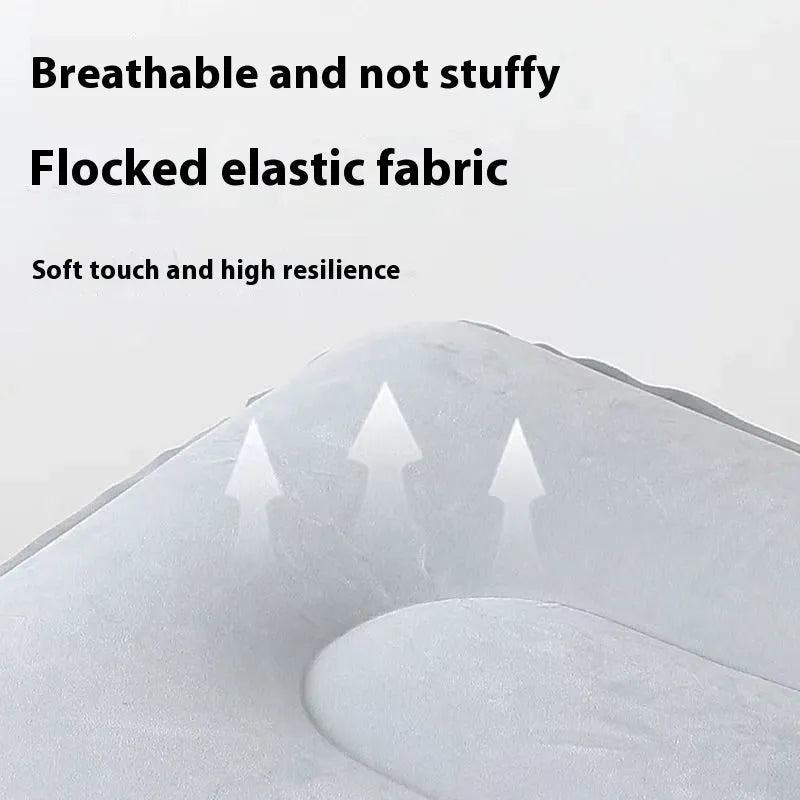 Grey inflatable seat cushion with a press valve, shown folded and inflated.