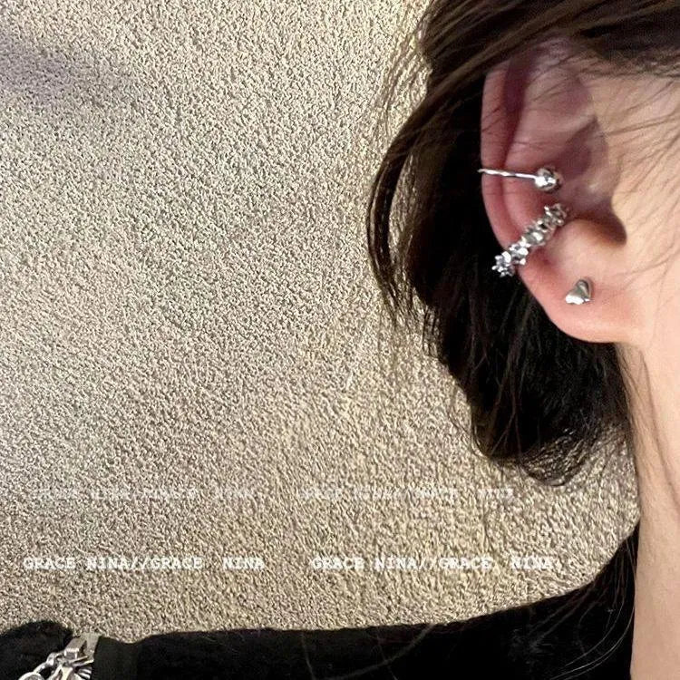 A pair of irregular geometric frosty finish ear clip earrings in colour B4710.