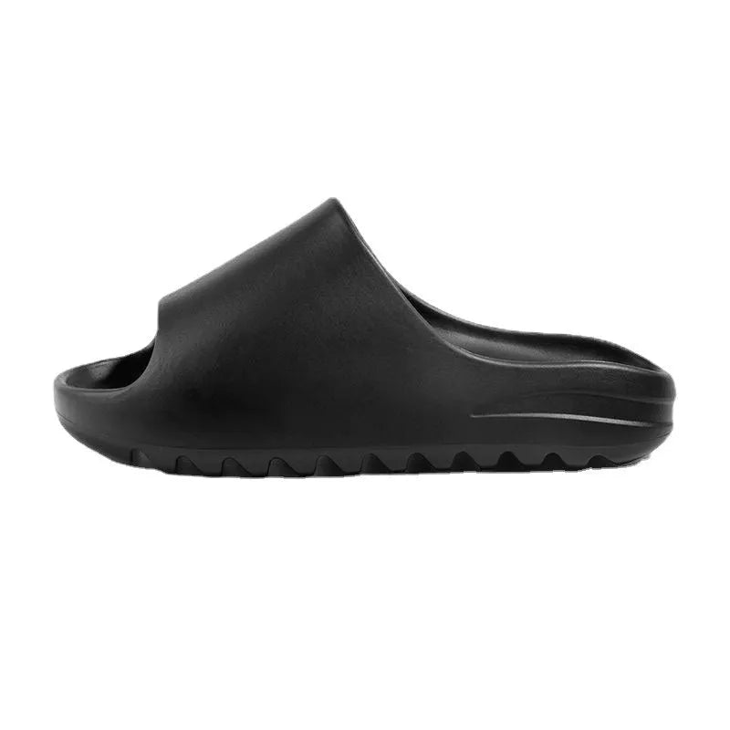 Women's thick-soled EVA beach slippers in beige, shown on a sandy background.