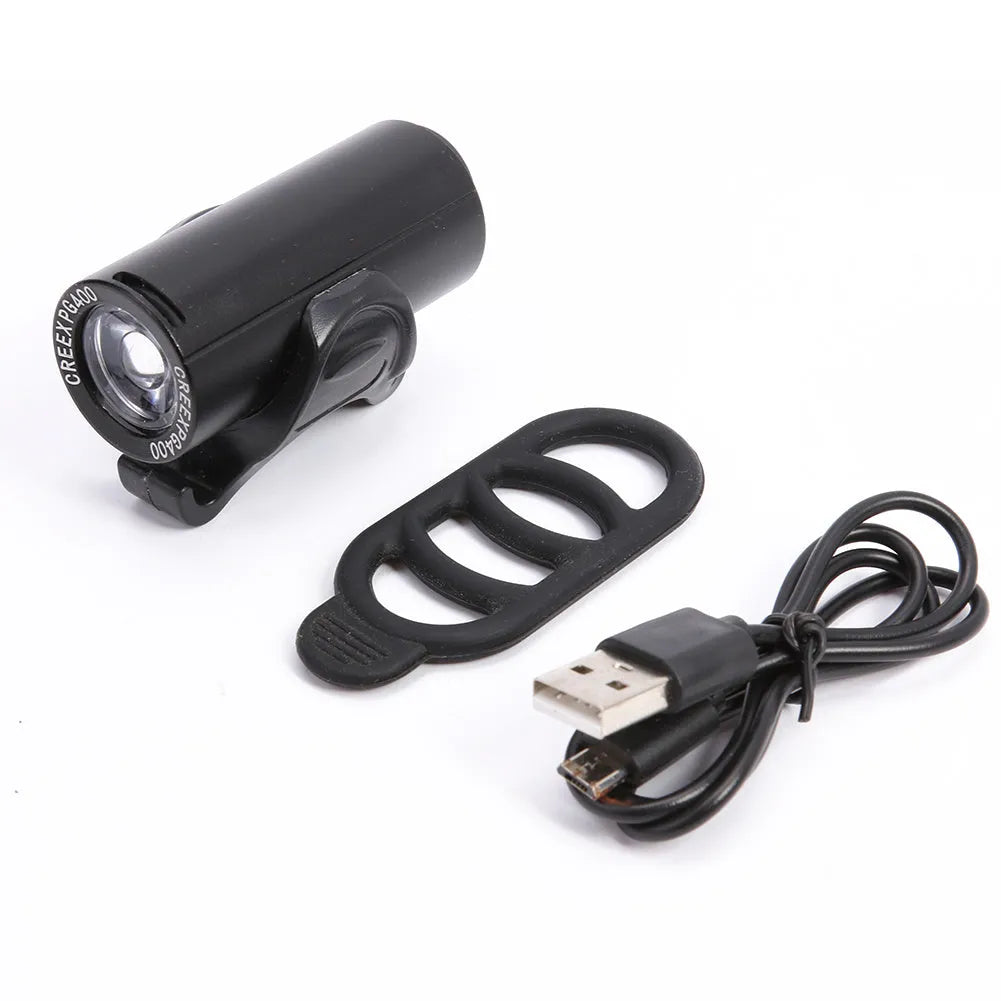 Black USB rechargeable bicycle front light with 350 lumen output mounted on handlebars.