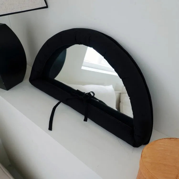 Soft rectangular fabric mirror panel in sapphire blue with a padded texture, shown hanging.