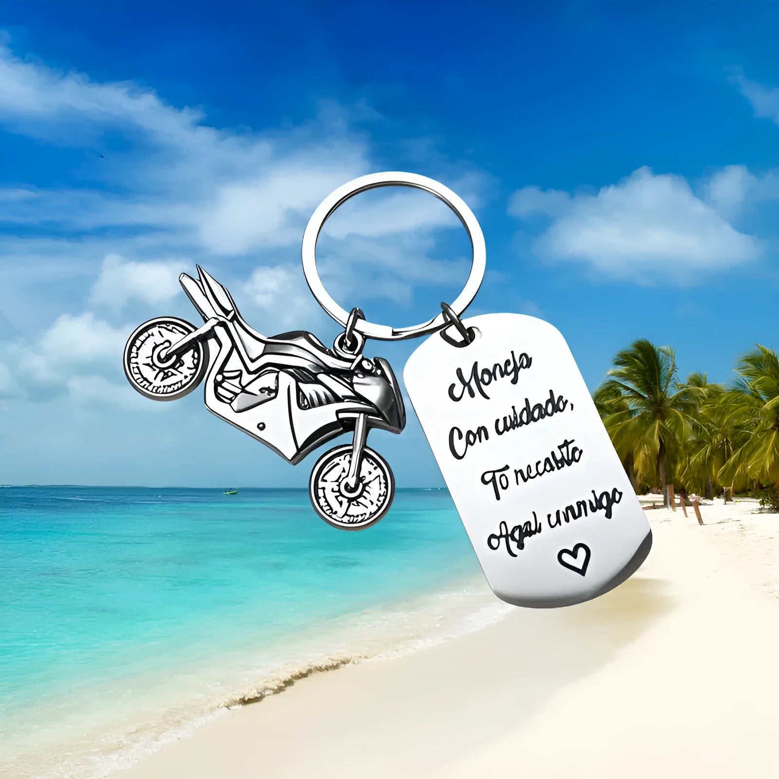Stainless steel motivational keychain for motorcycle keys with a flannel storage bag.