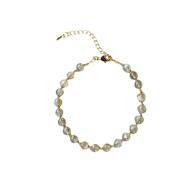 Blue moonstone bracelet with 14K gilded metal celestial design